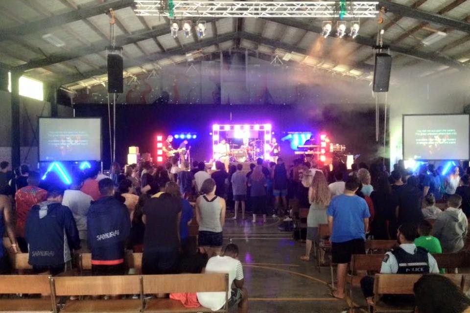 Indoor concert with hired sound system and stage lighting