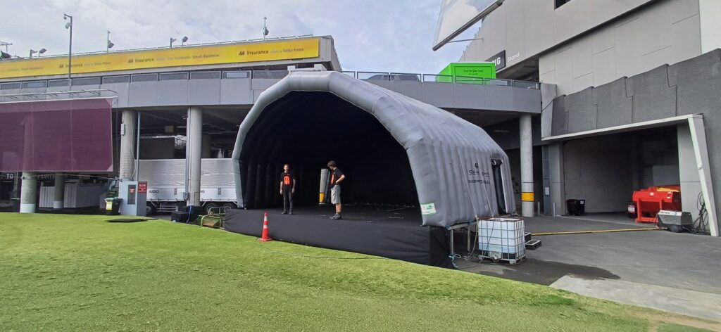 Inflatable stage cover set up on a stadium concourse